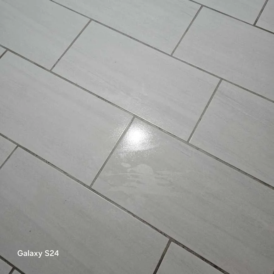Grout and light floor tiles after deep cleaning, view 1